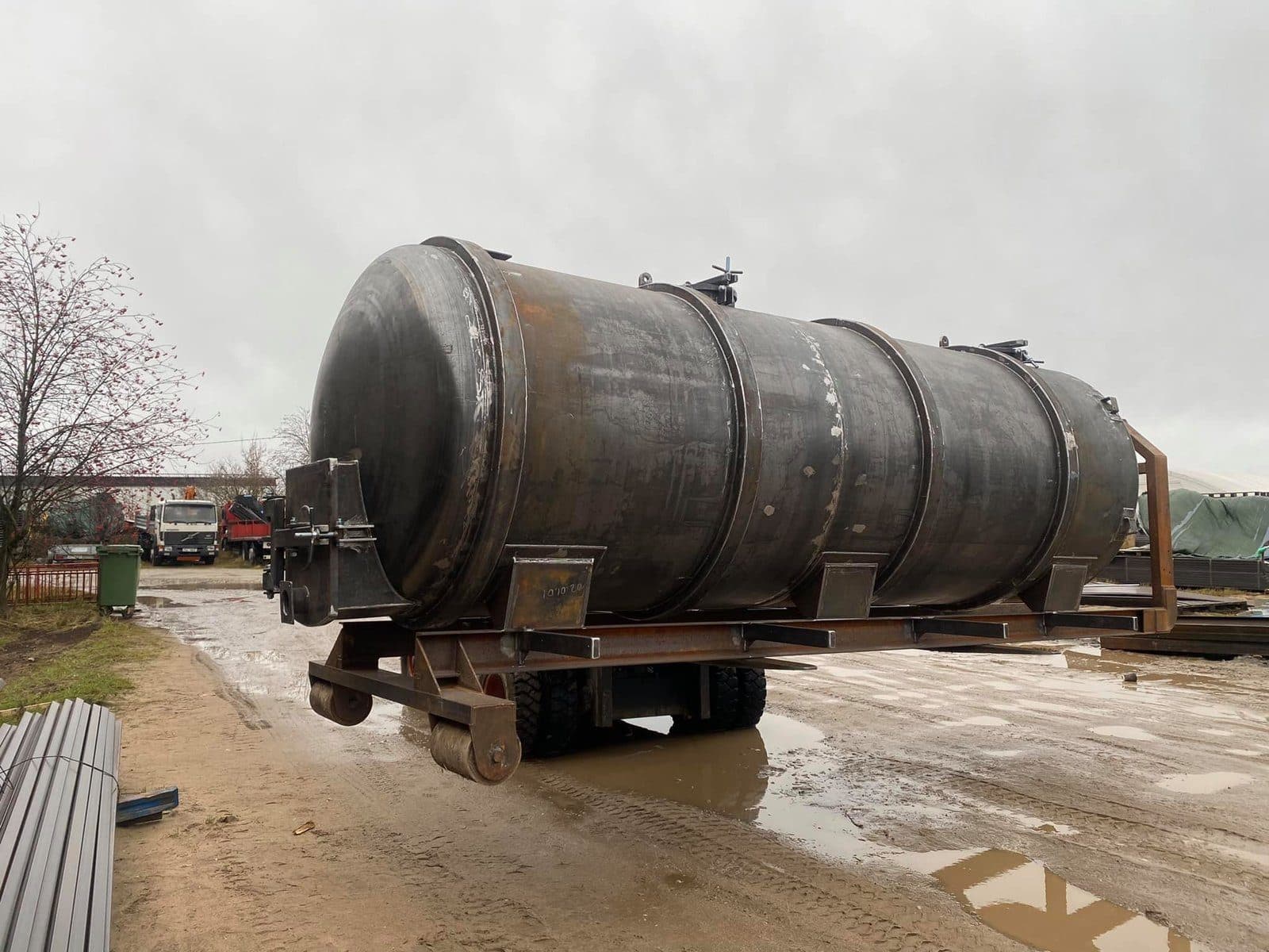 Cylindrical welded steel tank on its frame in the yard