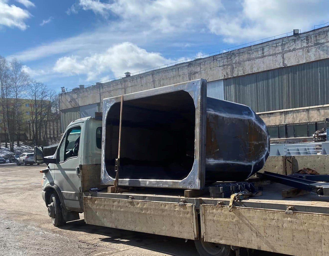 Rectangular-to-round steel duct section on a flatbed truck