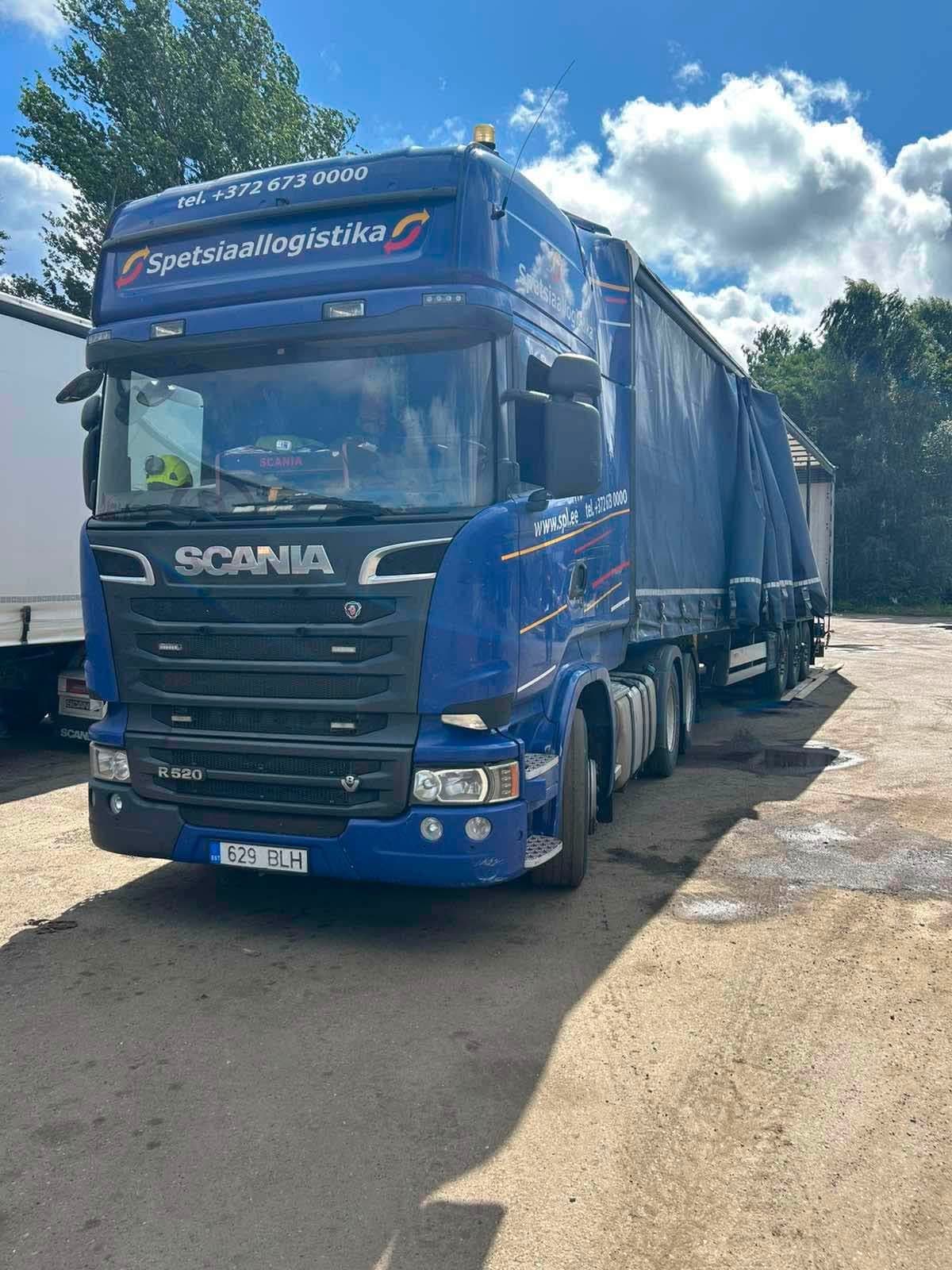Blue Scania curtainsider truck ready for loading at the Novatex yard in Tallinn